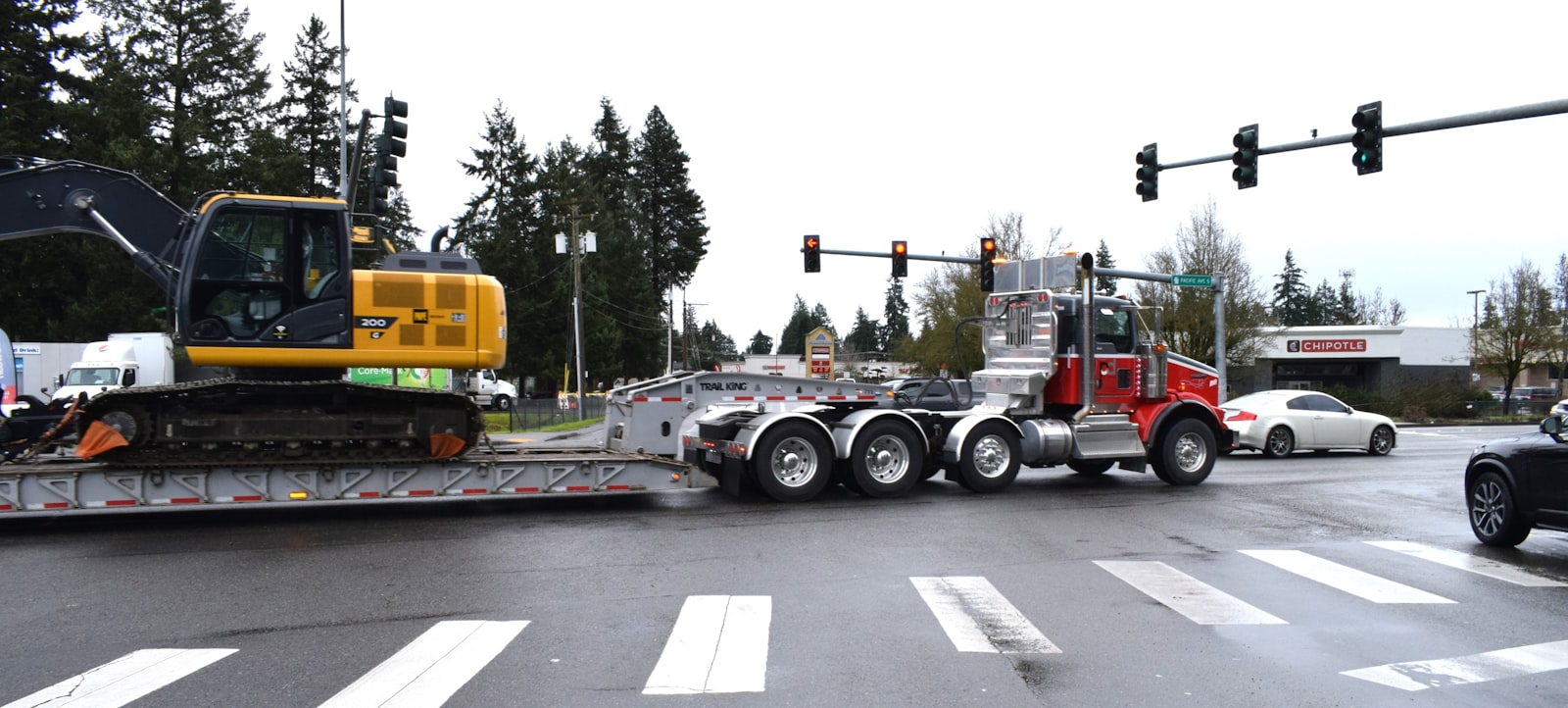Oversize transport navigating a constrained maneuver
